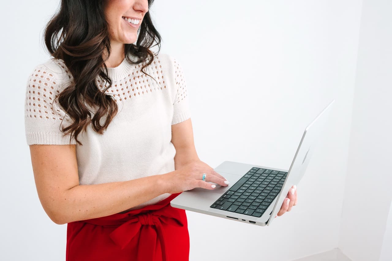 Woman holding laptop